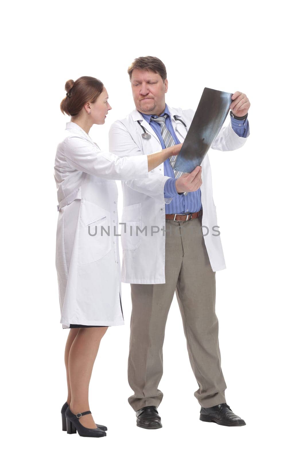 in full growth. medical colleagues standing together.isolated on a white background.