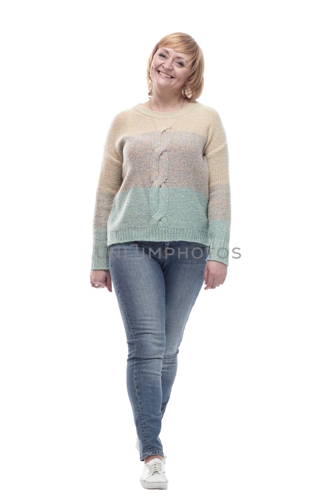 full-length. casual woman in jeans striding forward. isolated on a white background.