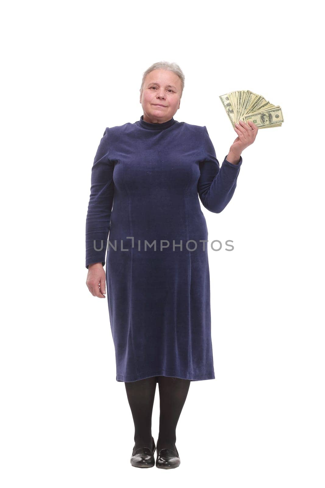 Portrait of smiling old woman holding money in hand on white background