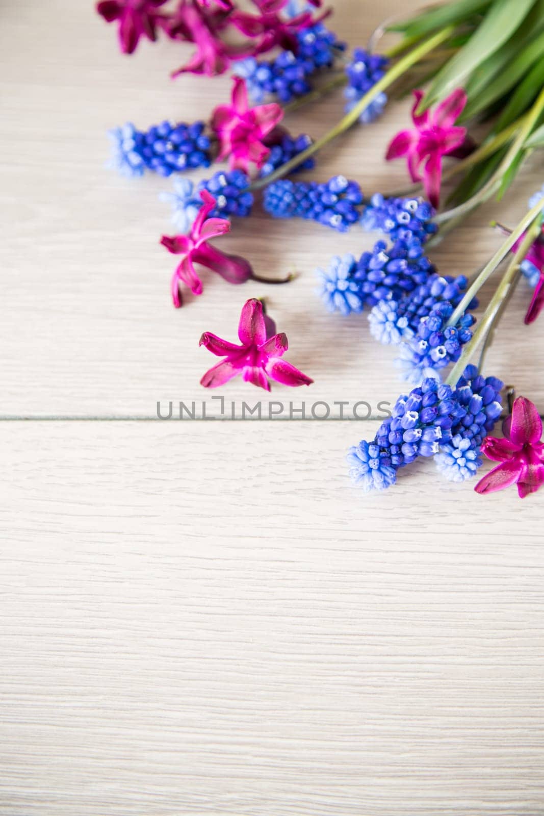 beautiful bouquet of spring flowers on a wooden table, rustic style.