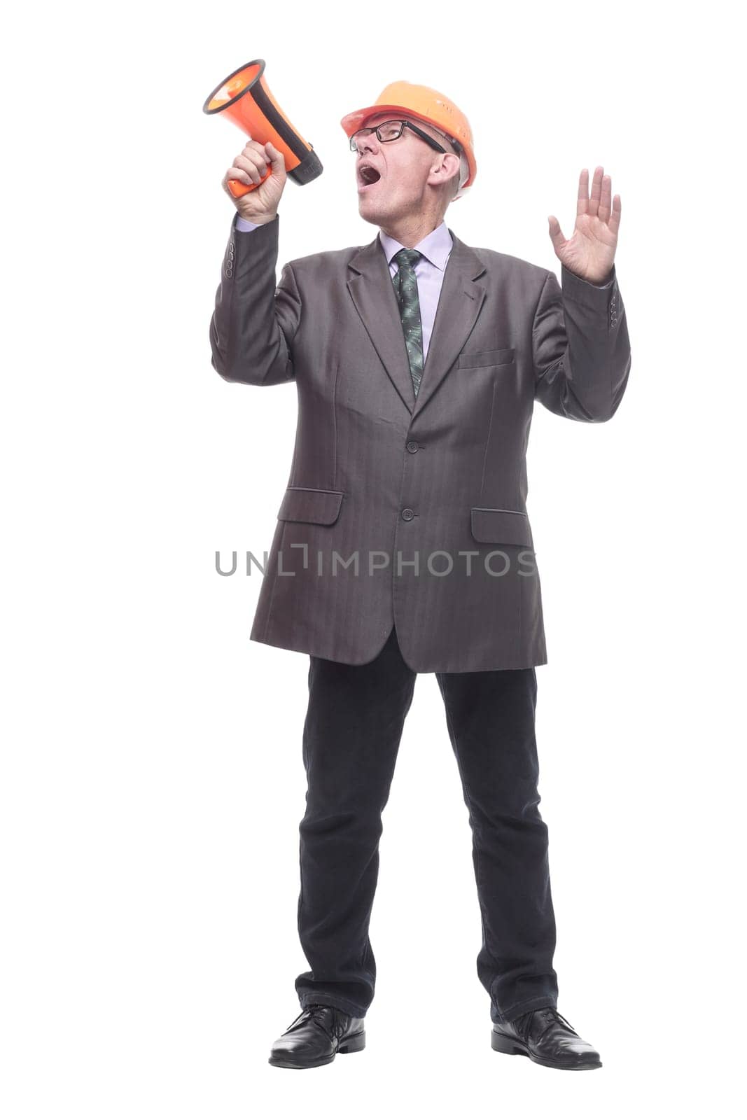 business man in a protective helmet with a megaphone. isolated on a white background.