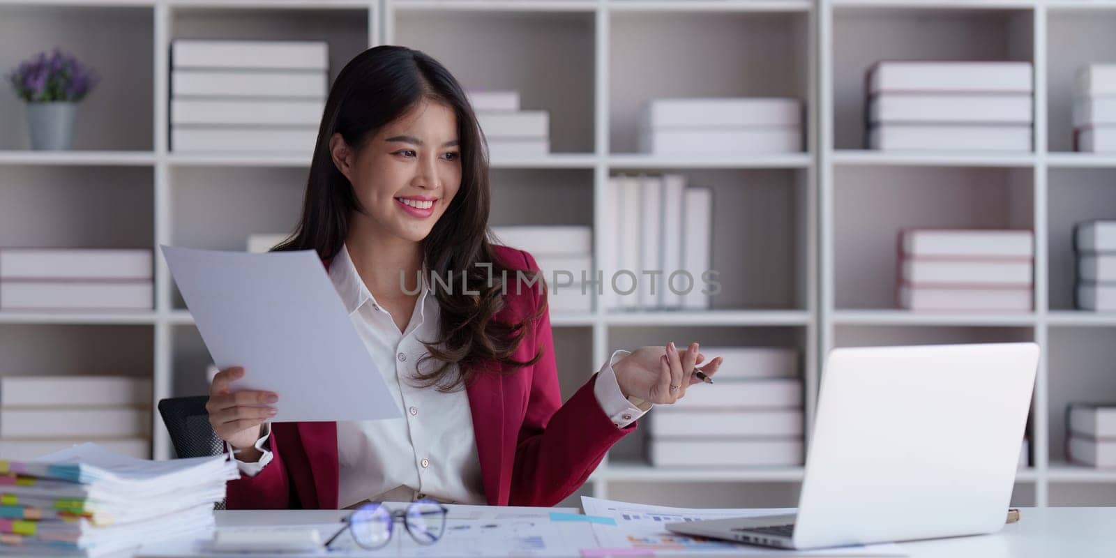 Accountant asian woman working on laptop and do document, tax, exchange, accounting and Financial advisor concept by itchaznong