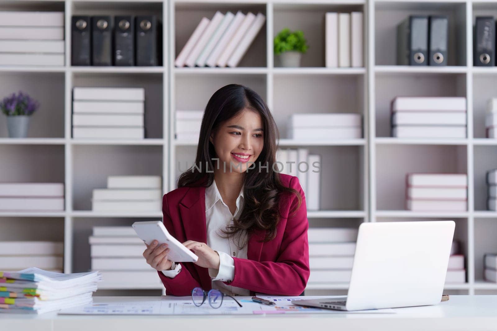Accountant asian woman working on laptop and do document, tax, exchange, accounting and Financial advisor concept by itchaznong