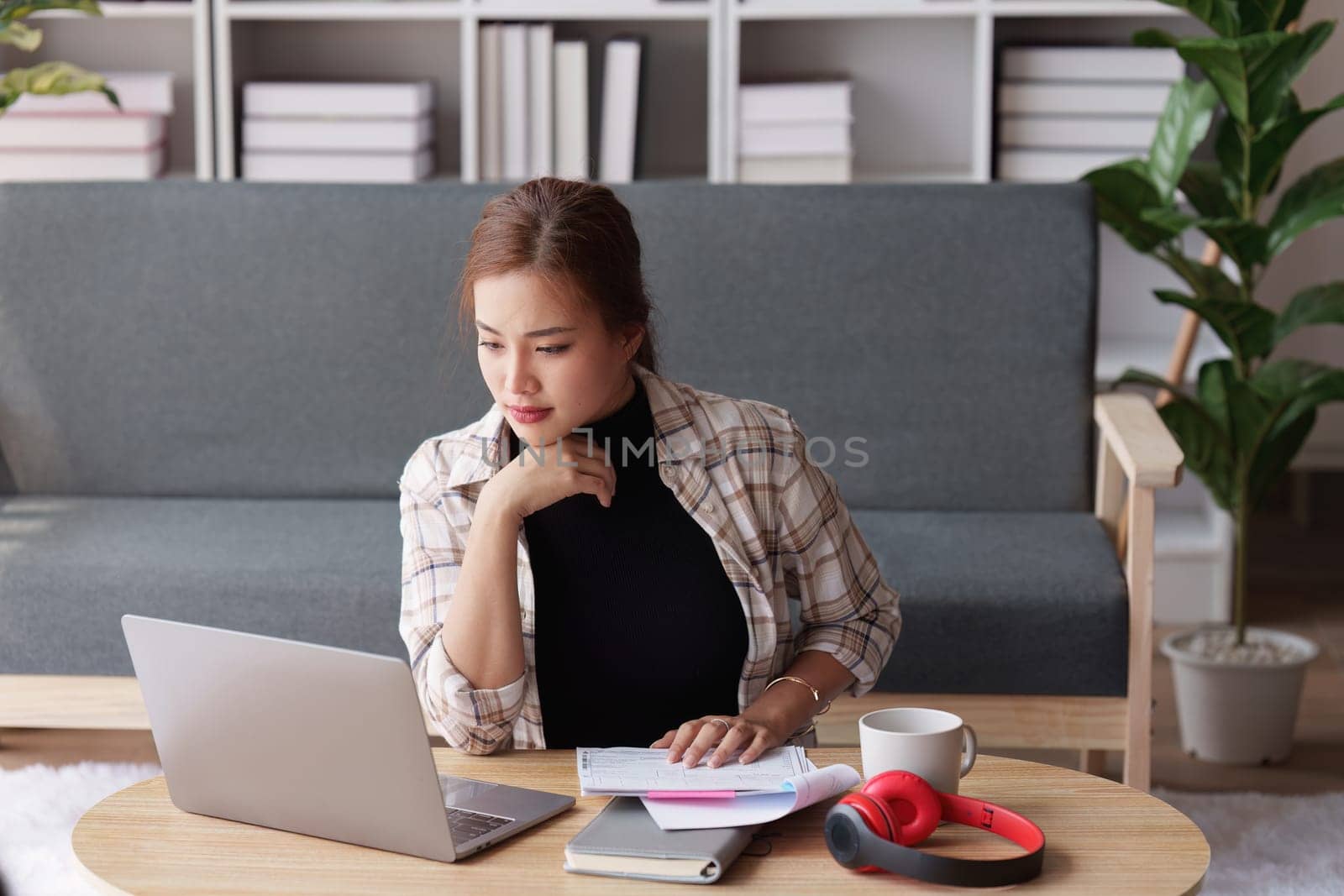 Accountant woman working on laptop and do document, tax, exchange, research, accounting and Financial advisor concept by itchaznong