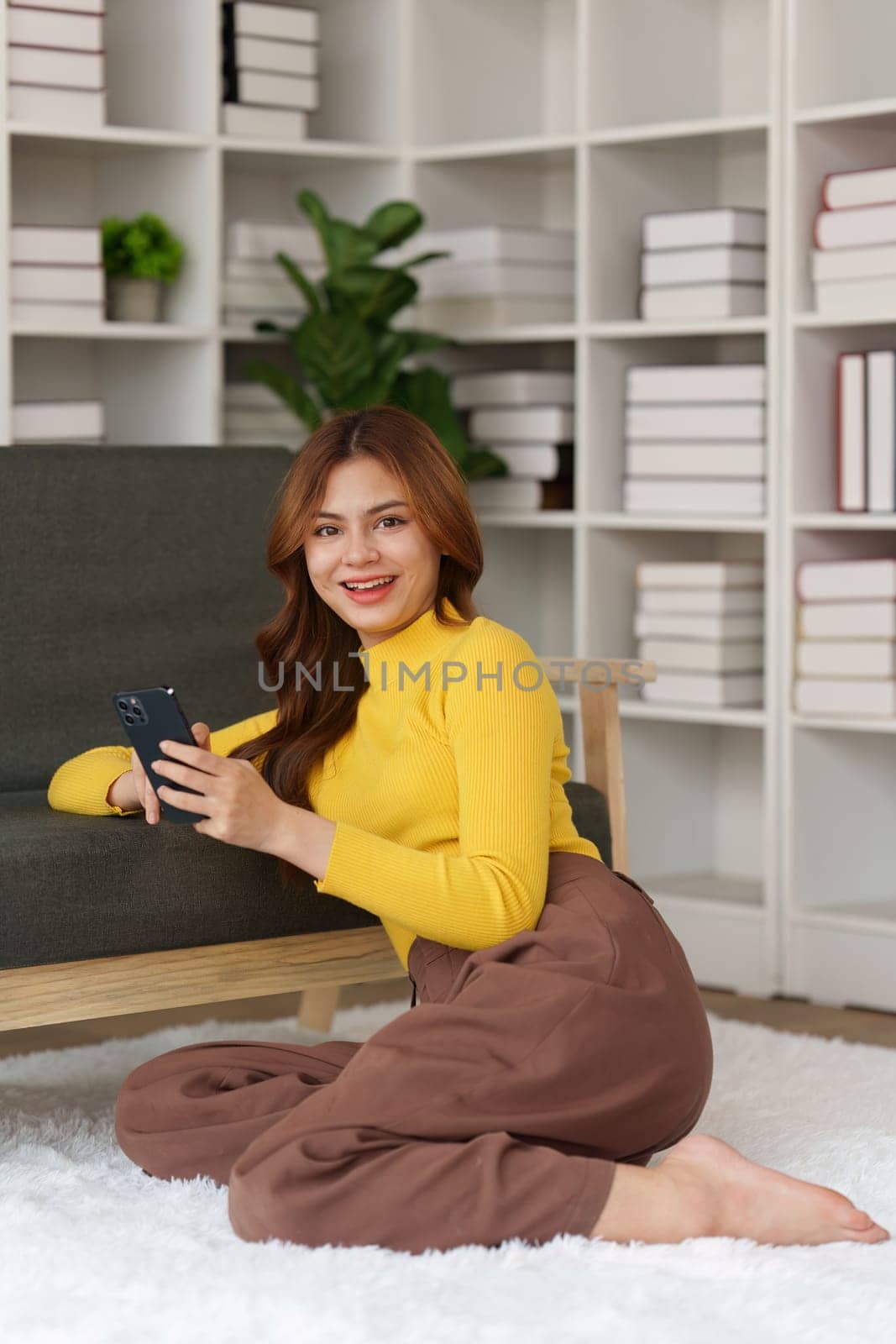 Attractive Asian woman resting comfortable living room and using mobile phone, Relax, Sofa, Lifestyle.