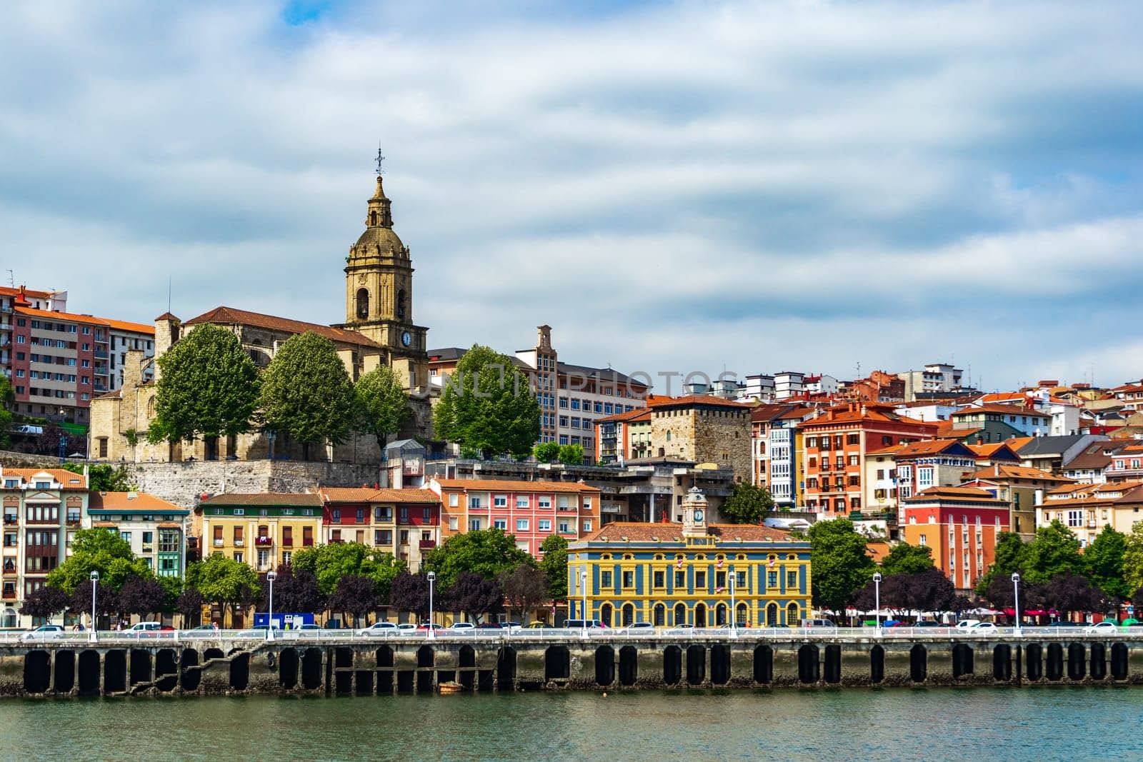 View of Portugalete town by Nervion river, and Sandra Maria basilica, Basque Country, Spain