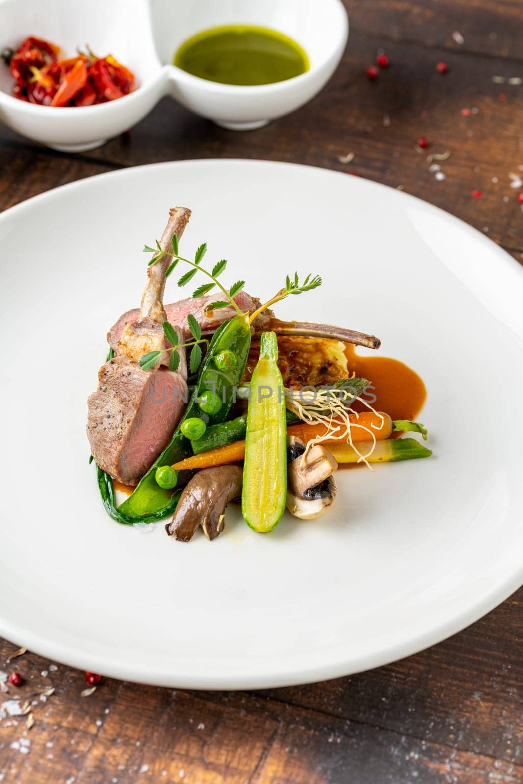 lamb chops with various vegetables at a fine dining restaurant by Sonat