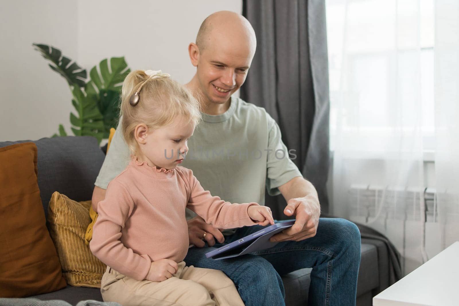 Deaf kid with hearing aid cochlear implant have fun with father - Hear aid and medicine innovating technology and diversity concept by Satura86