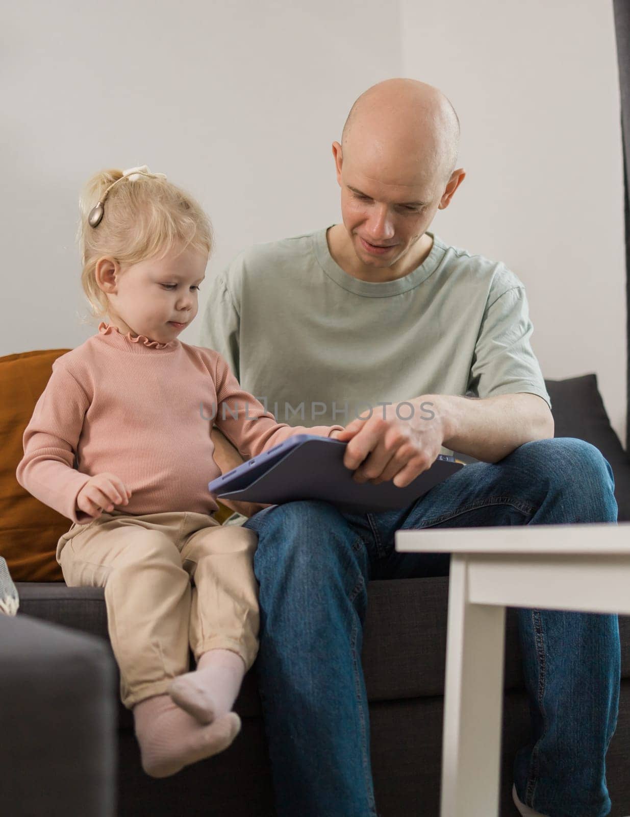 Deaf kid with hearing aid cochlear implant have fun with parents - Hear aid and medicine innovating technology and diversity