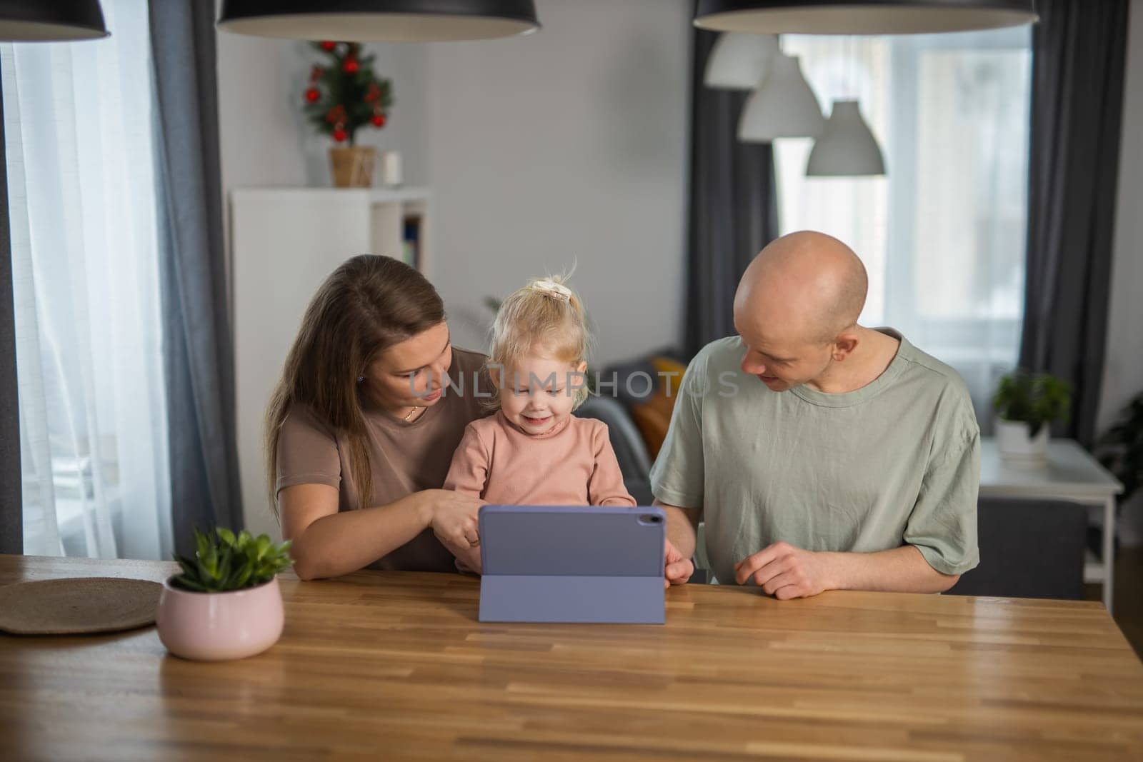 Deaf kid with hearing aid cochlear implant have fun with parents - Hear aid and medicine innovating technology and diversity