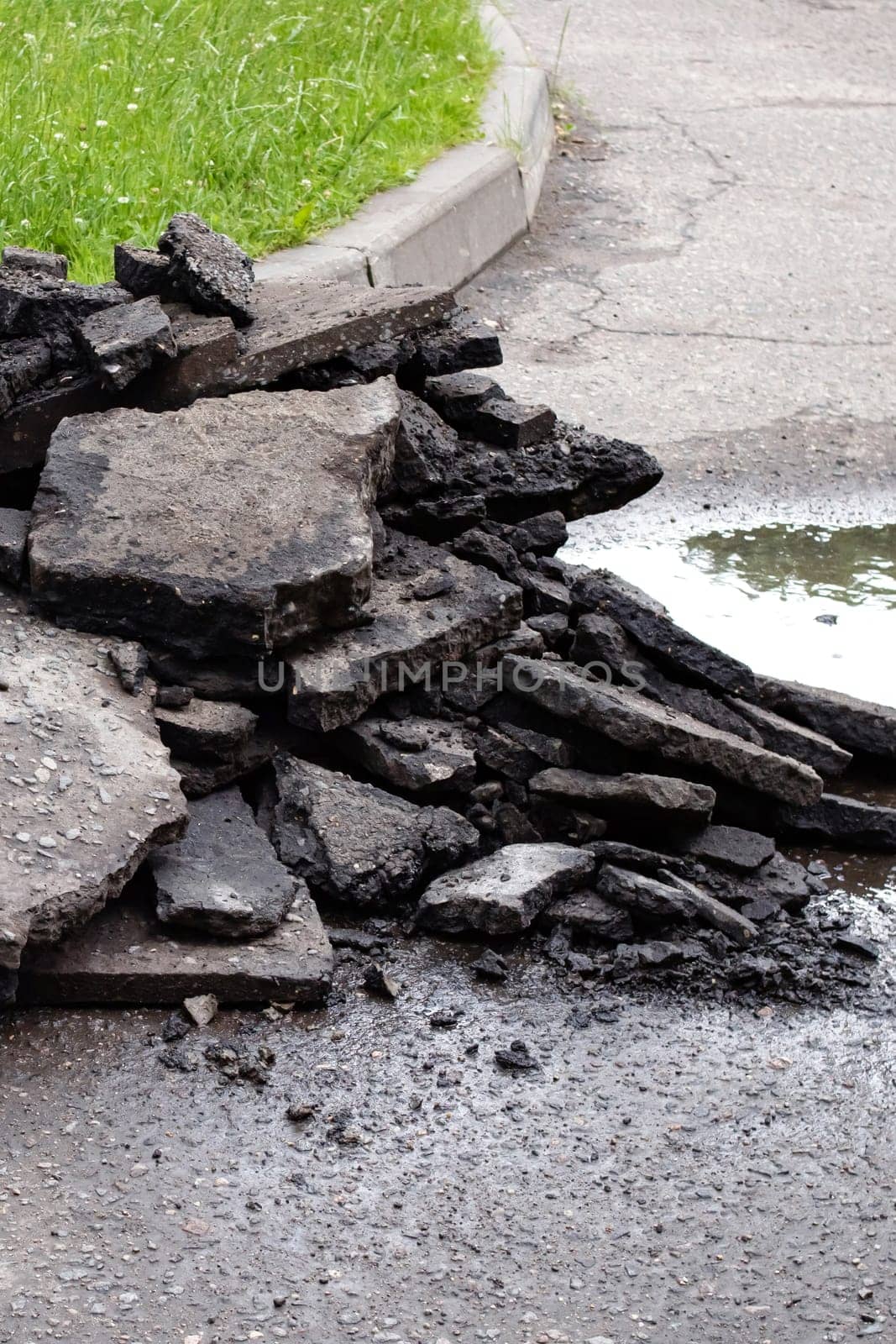 Pieces of asphalt after repair on the road