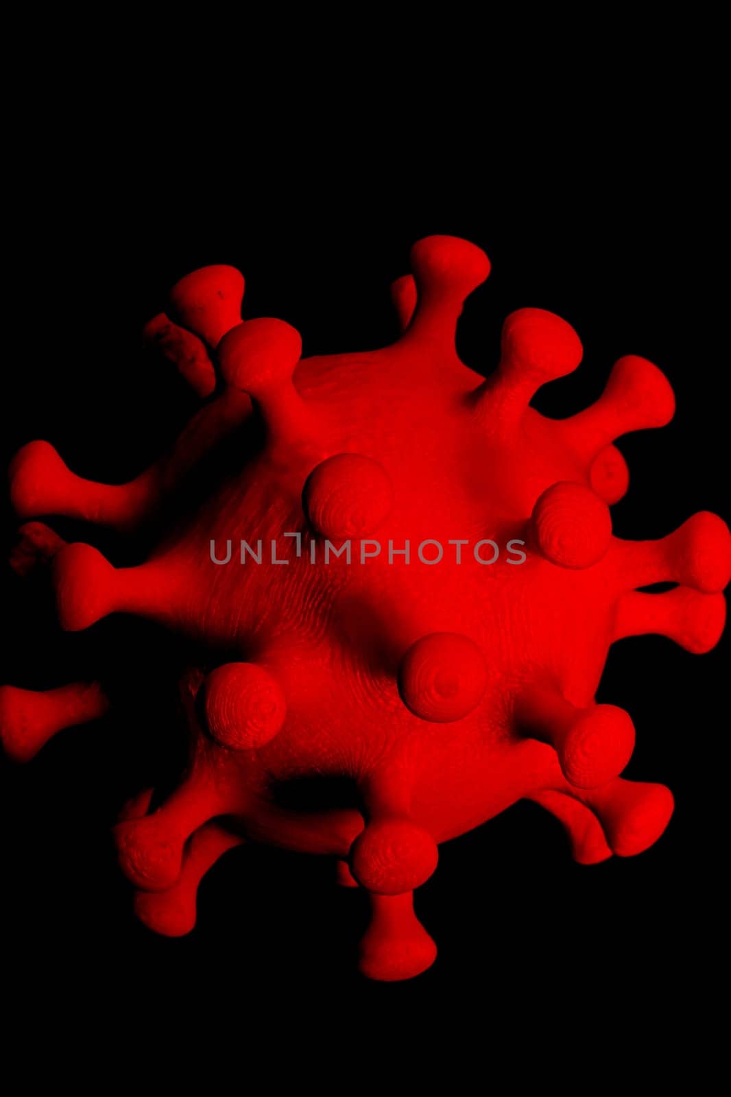 Red coronavirus on a black background close up