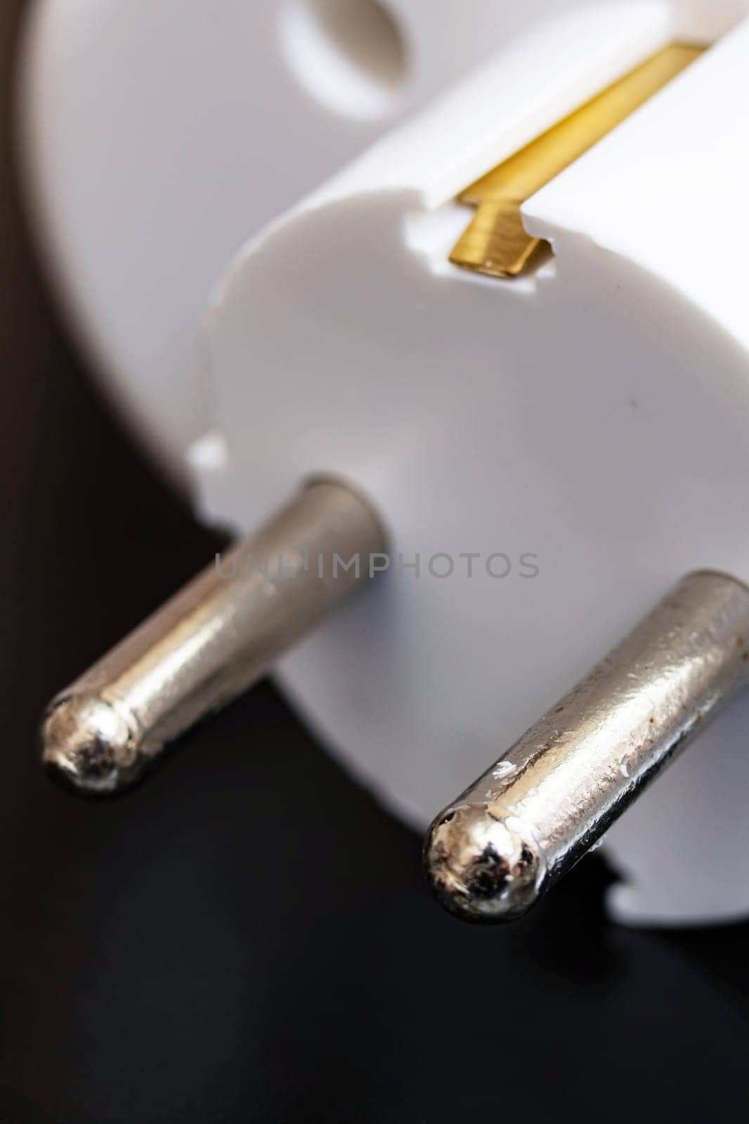 Tee outlet plug on a black wooden table