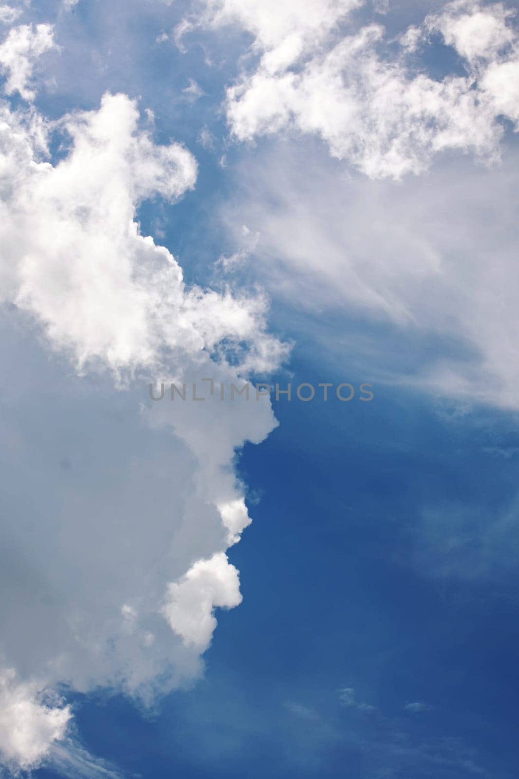 Lush white clouds in the blue sky, background