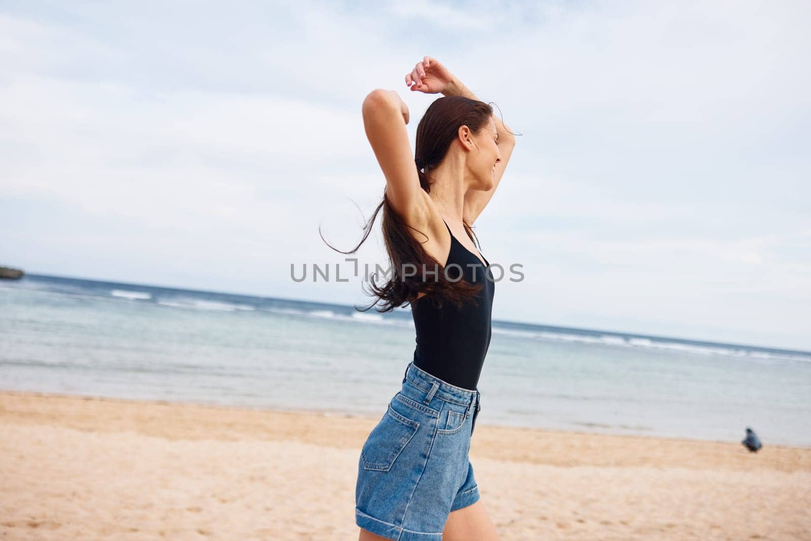 sunset woman travel ocean sexy running body smiling smile summer lifestyle long positive young flight hair walking female sea beauty relax beach