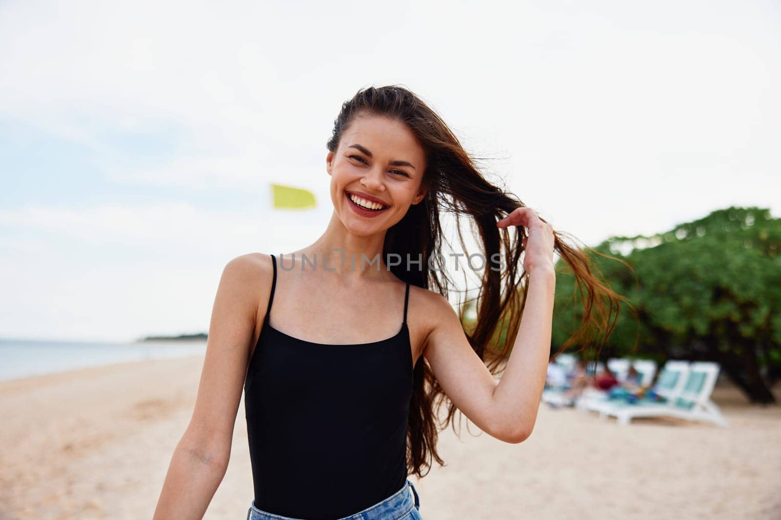 sea woman running beach nature smile water ocean relax summer sand holiday copy-space walk sunset vacation beautiful smiling carefree dress young