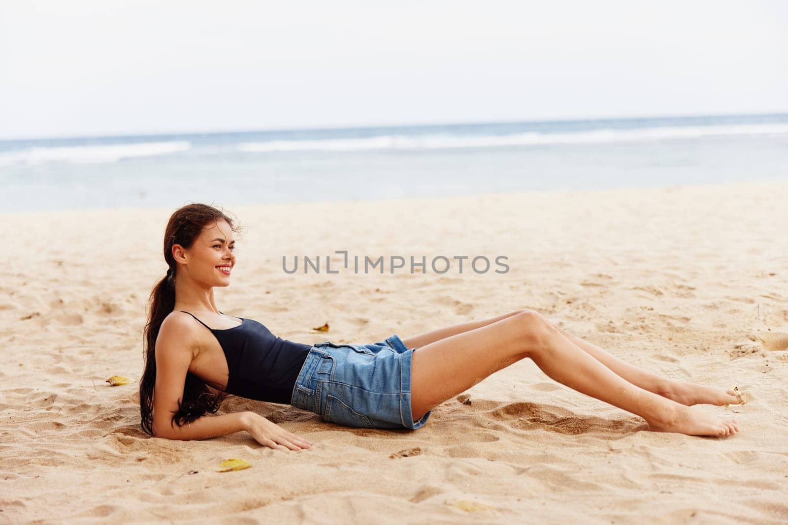 sea woman vacation sitting nature freedom travel sand beach tan smile by SHOTPRIME