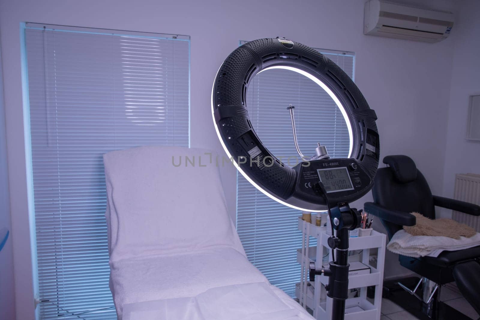 circular neon LED lamp in a beauty salon, Popular modern light for make-up and beauty care. High quality photo