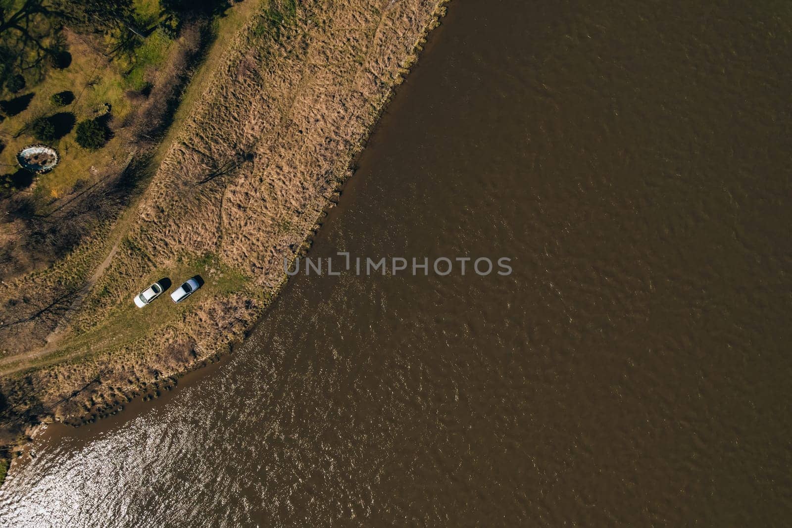 Aerial view drone of two cars on bank river. Concept of Outdoor activity spending time in unity with nature. Getting away. Local travel