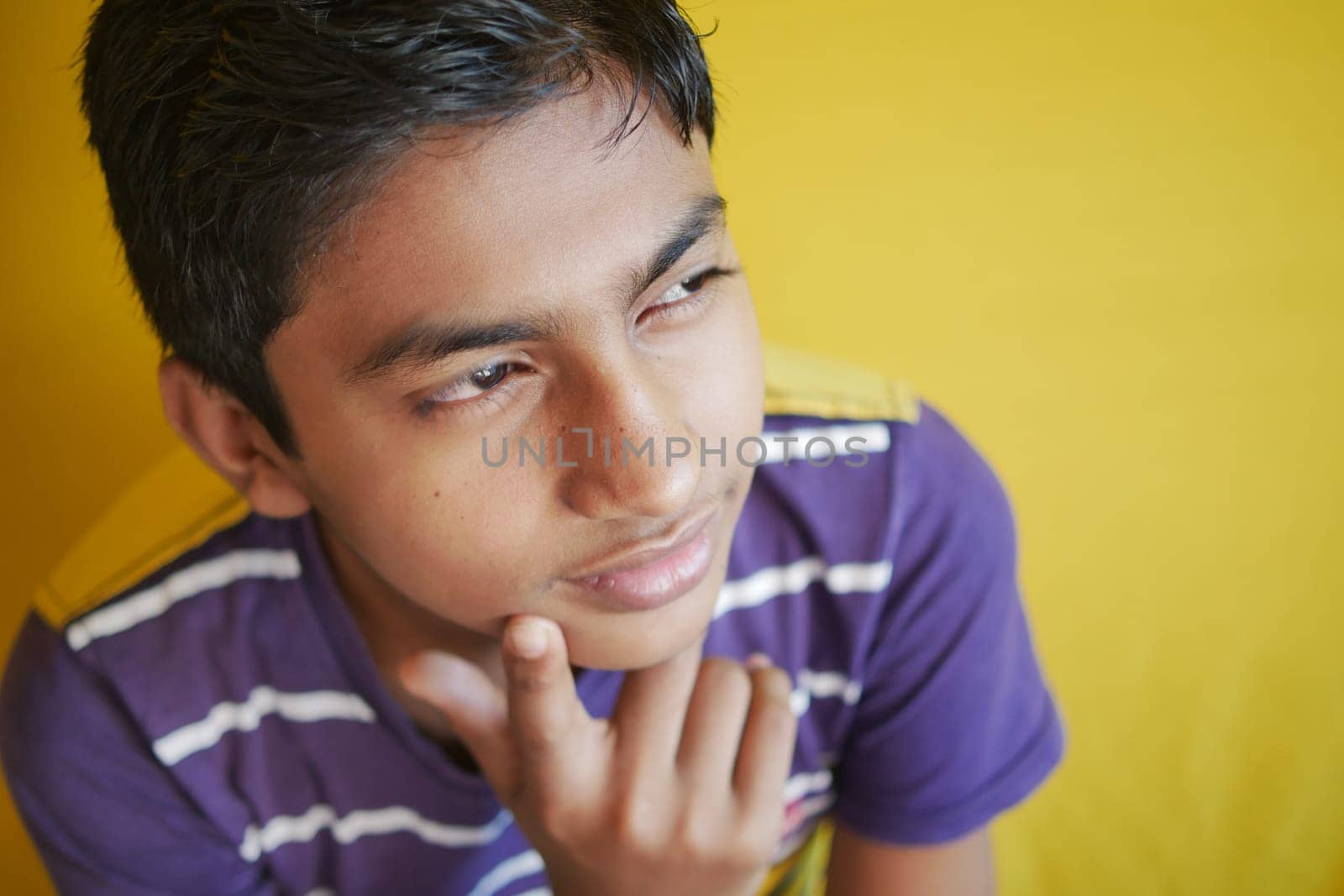 side view of happy and thoughtful boy .