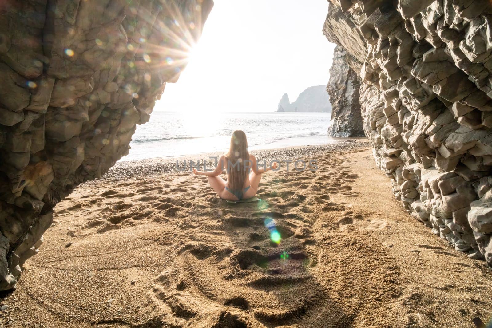 Woman sea pilates. Sporty happy middle aged woman practicing fitness on beach near sea, smiling active female training on yoga mat outside, enjoying healthy lifestyle, harmony and meditation. by panophotograph