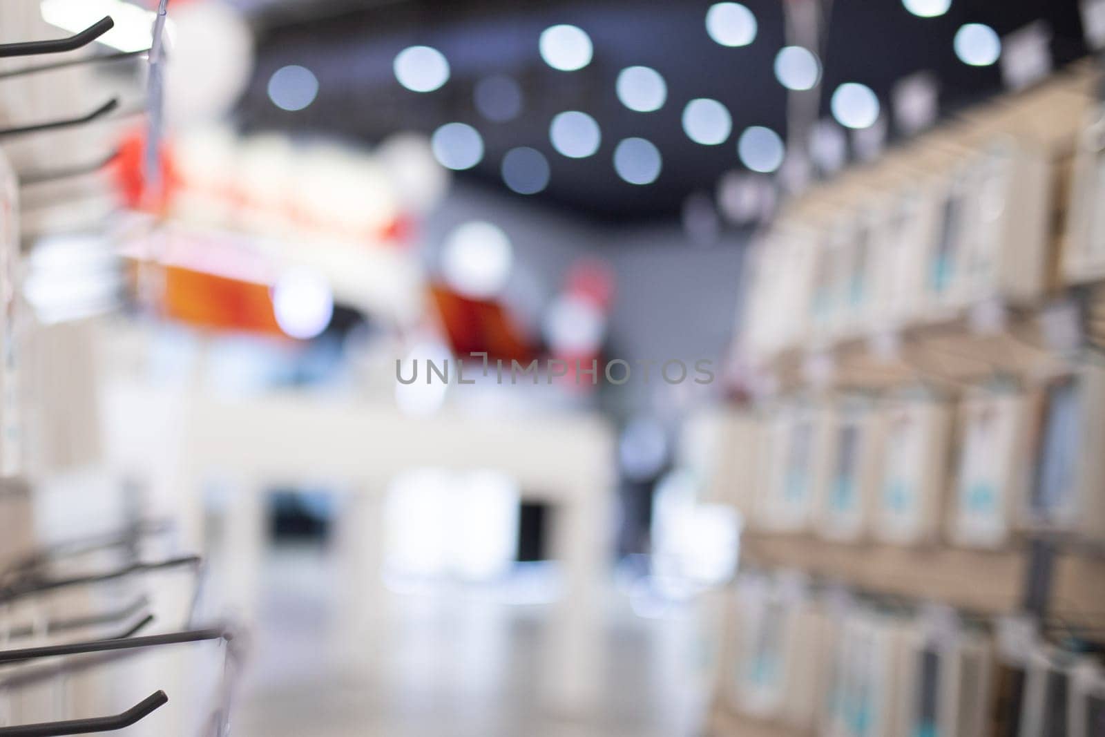 Blurred background from small electronics store and cellular accessories.