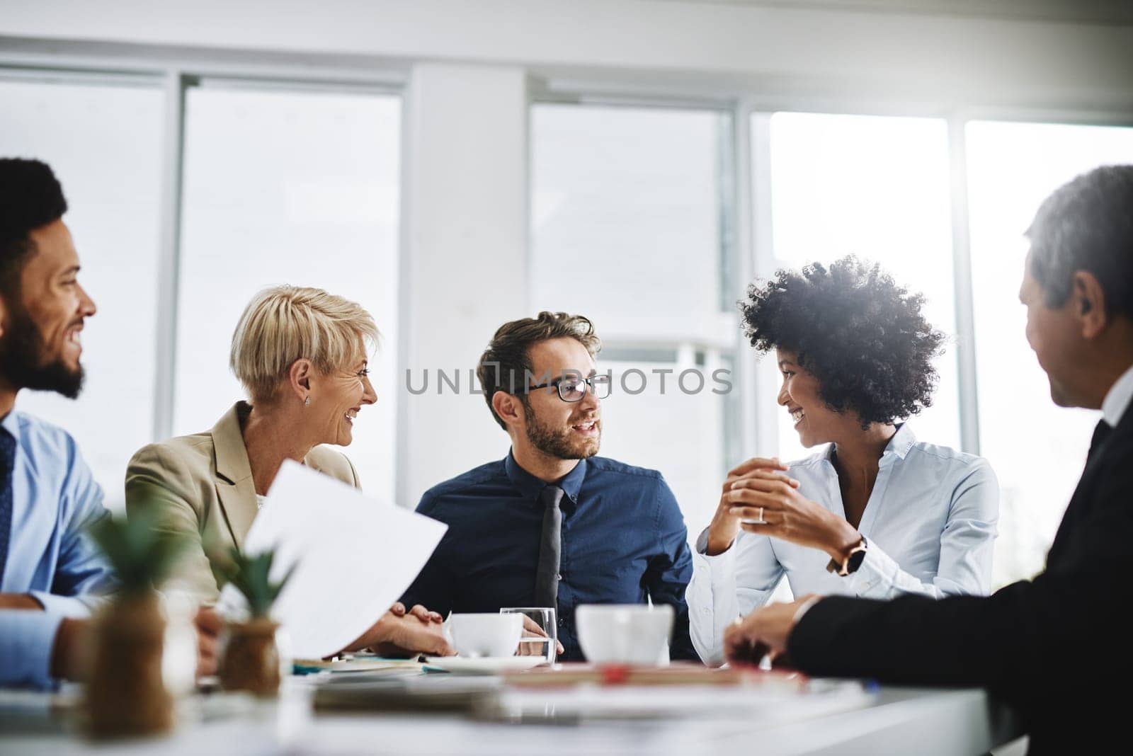 Business people, team meeting and planning with company contract and deal with conversation. Staff, communication and paperwork with a businessman with diversity coworkers working on a job strategy.