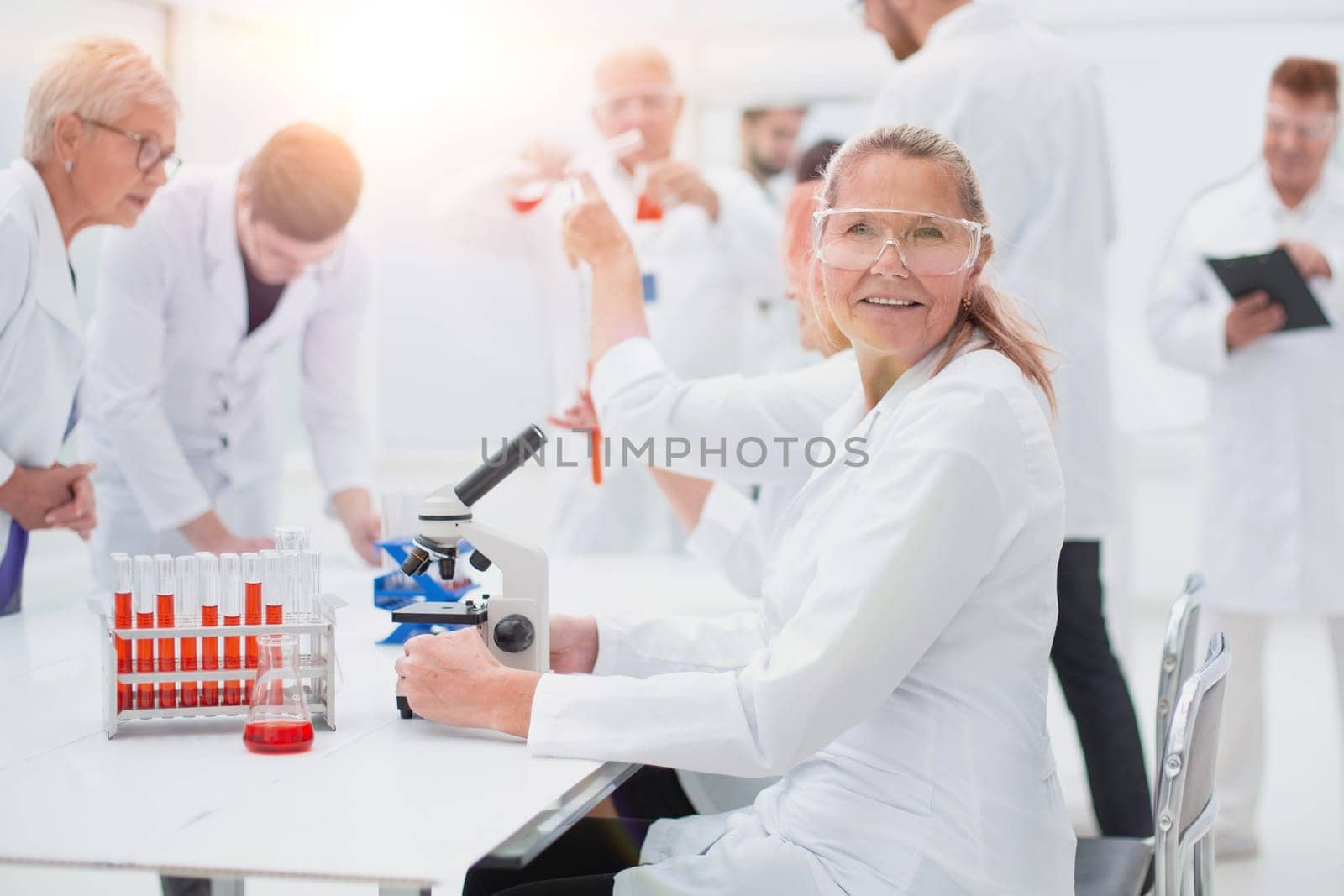 close up. senior female scientist sitting at a laboratory table. photo with a copy-space.