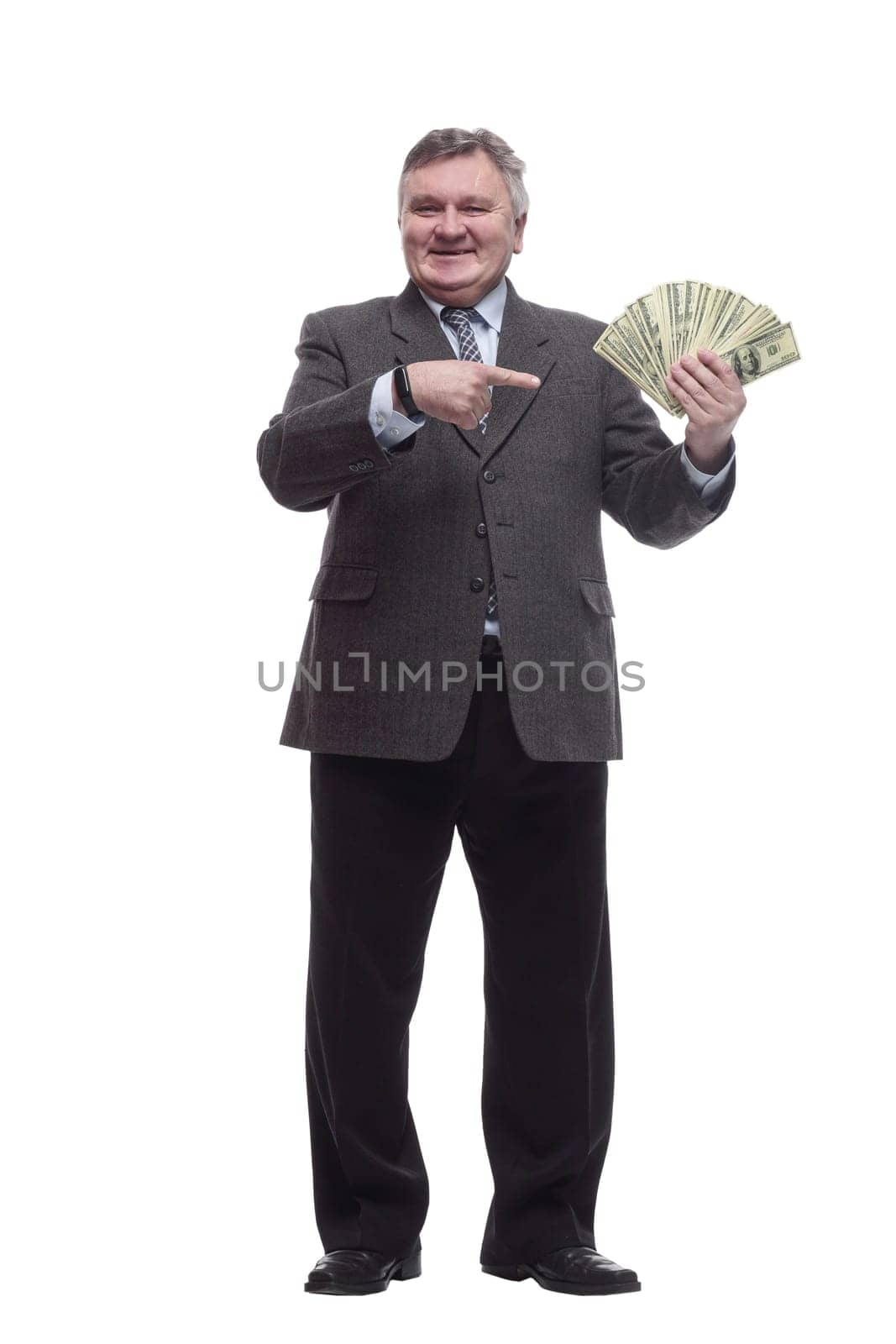 in full growth.happy entrepreneur with banknotes. isolated on a white background.
