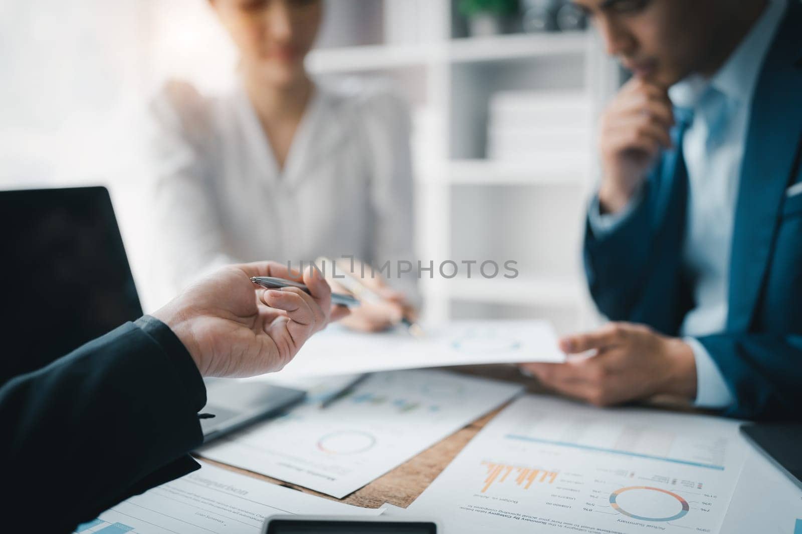 Asian business advisor meeting to analyze and discuss the situation on the financial report in the meeting room.Investment Consultant, Financial , teamwork ,brainstorming ,startup and accounting.