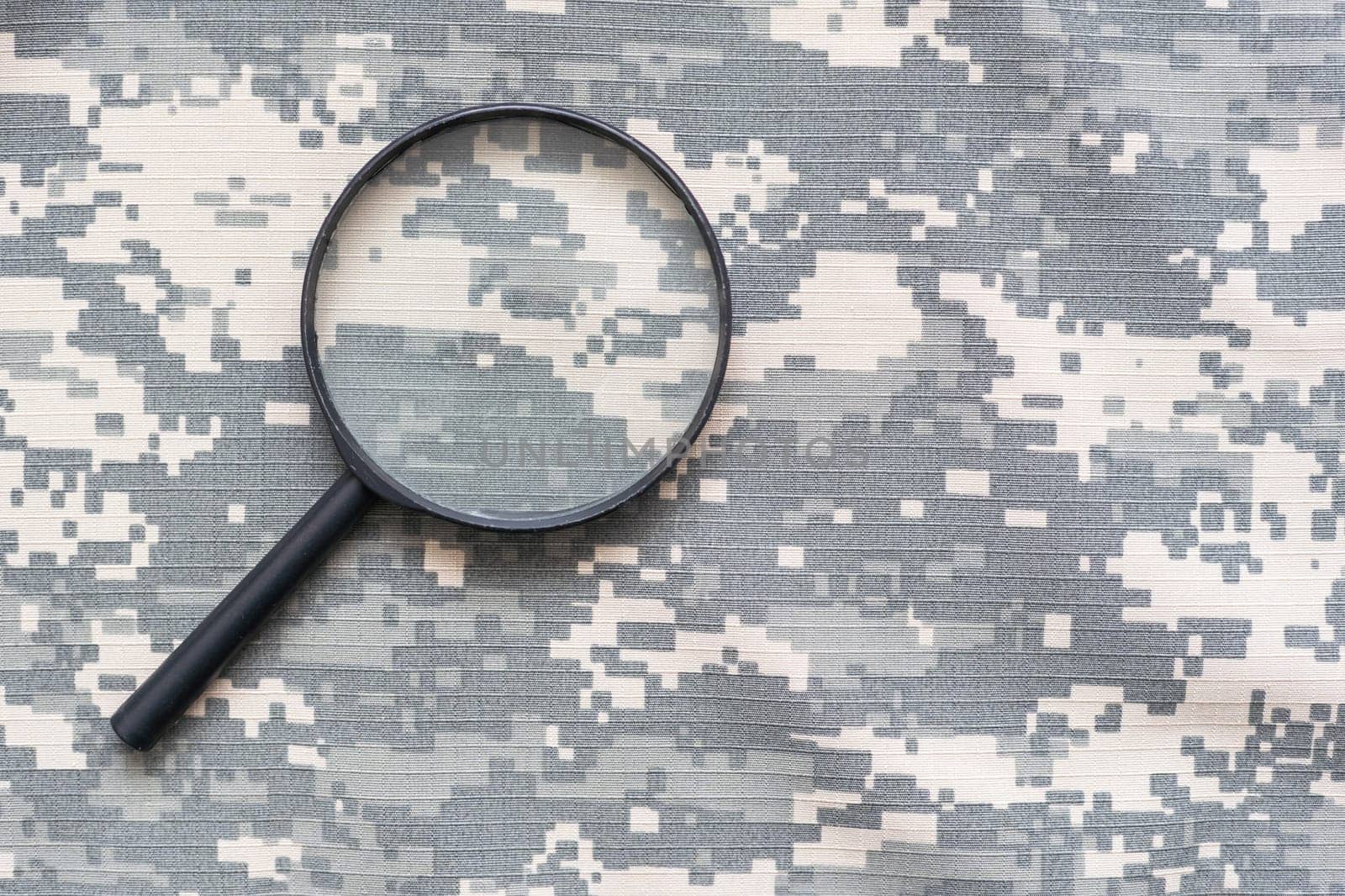 magnifier on green military uniform by Andelov13