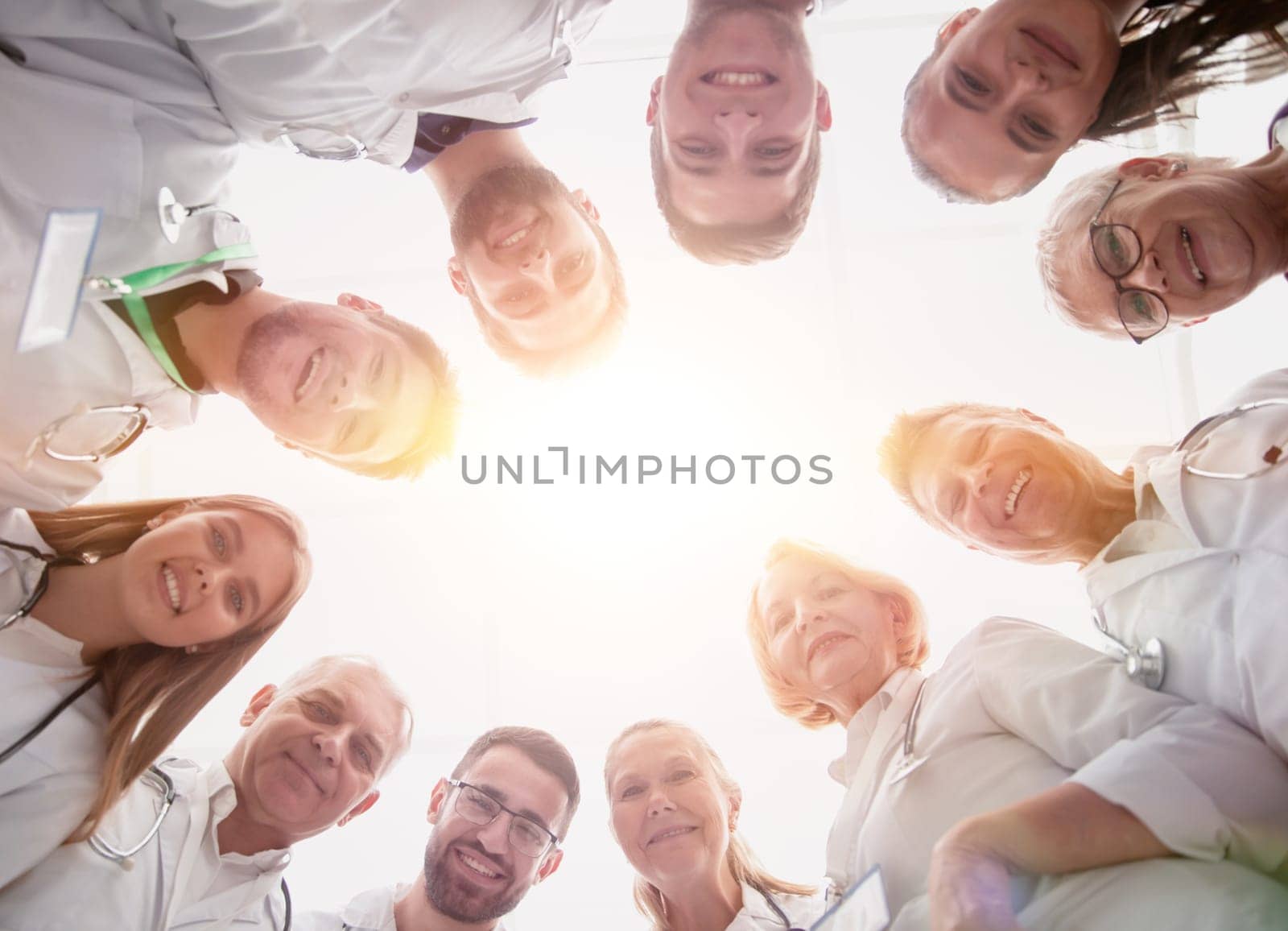 close up. group of doctors standing in a circle and looking at you by asdf