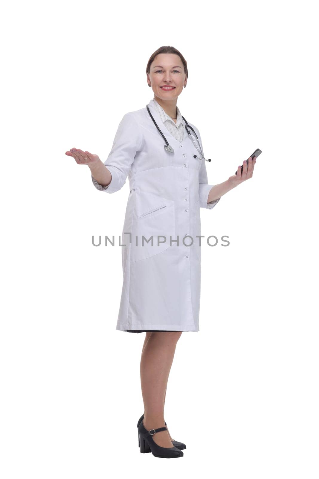 in full growth.female doctor with a smartphone. isolated on a white background.