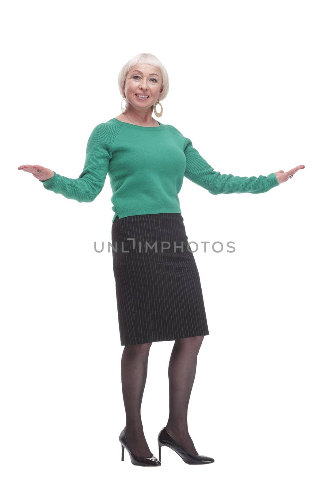 in full growth. smiling woman in a fashionable jumper. isolated on a white background.