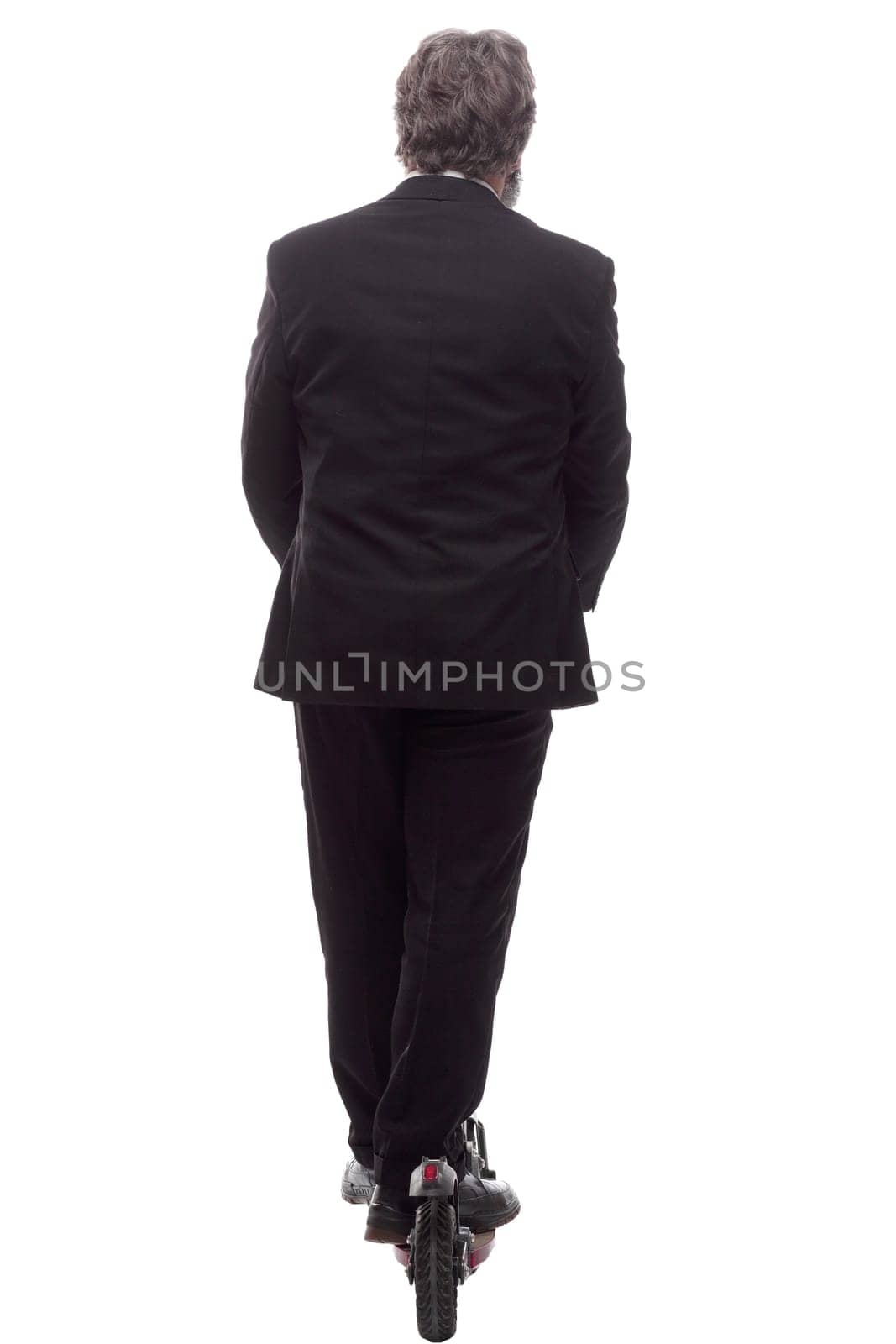 rear view. a business man with an electric scooter reads an ad. isolated on a white