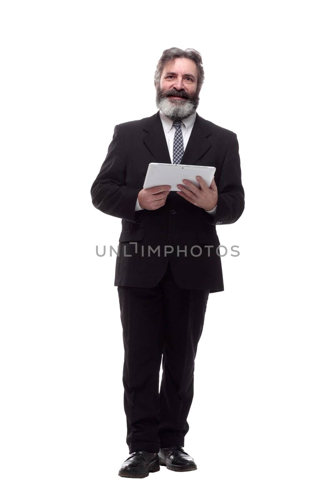 in full growth. a smiling business man with a digital tablet. isolated on a white