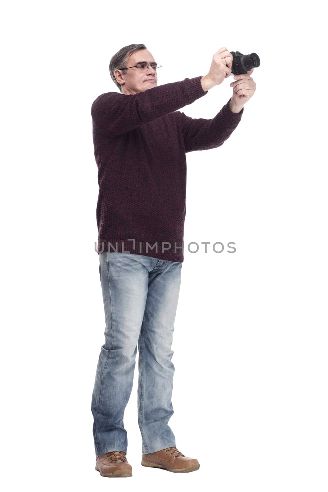 full-length.casual man with a camera. isolated on a white background.