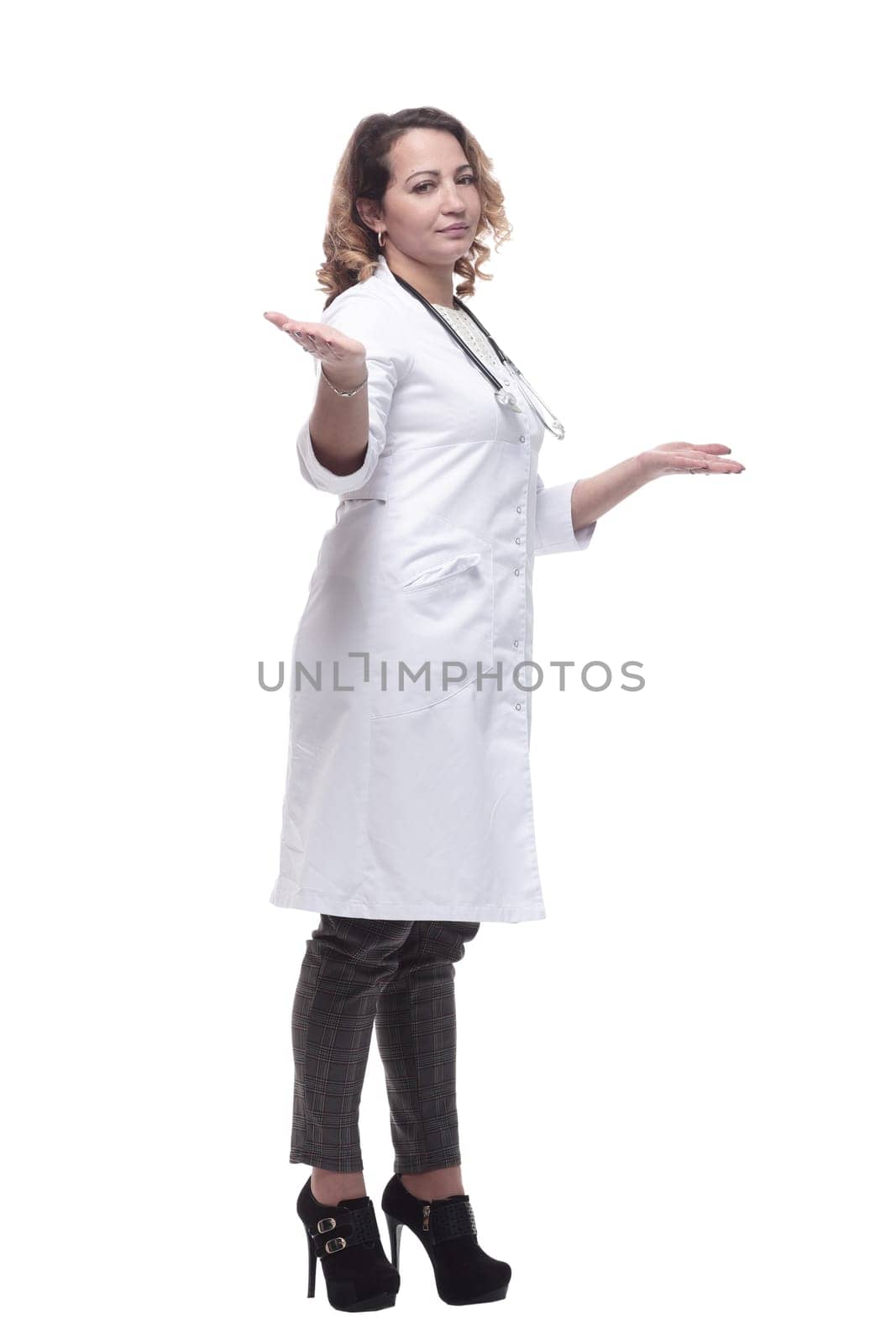 in full growth. young woman doctor with a stethoscope. isolated on a white background.