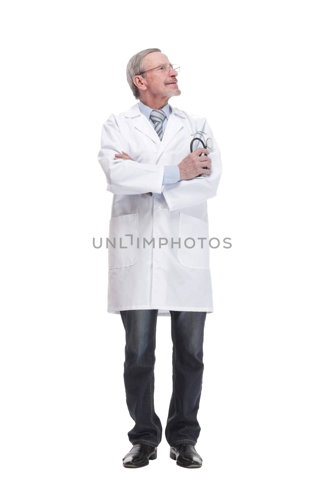 Smiling experienced doctor with a stethoscope on a white background looking at camera