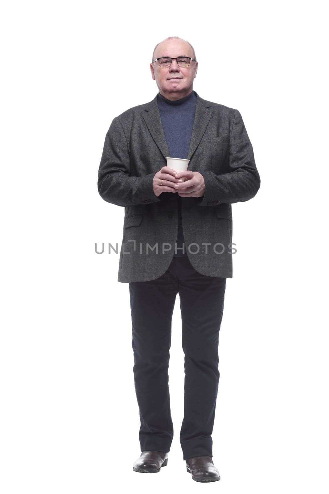 in full growth. confident business man with coffee to take away. isolated on a white background