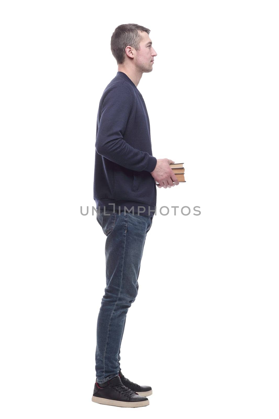 young man with a stack of books . isolated on a white background.