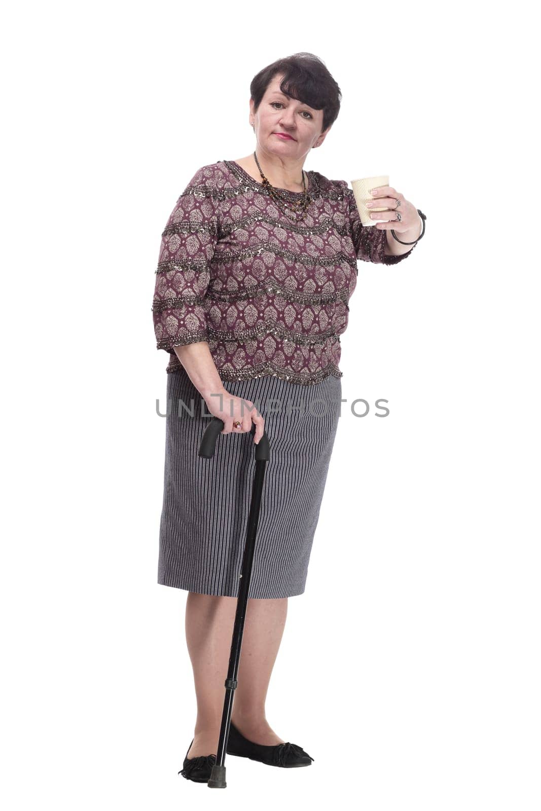 full-length. casual elderly woman with takeaway coffee. isolated on a white background.