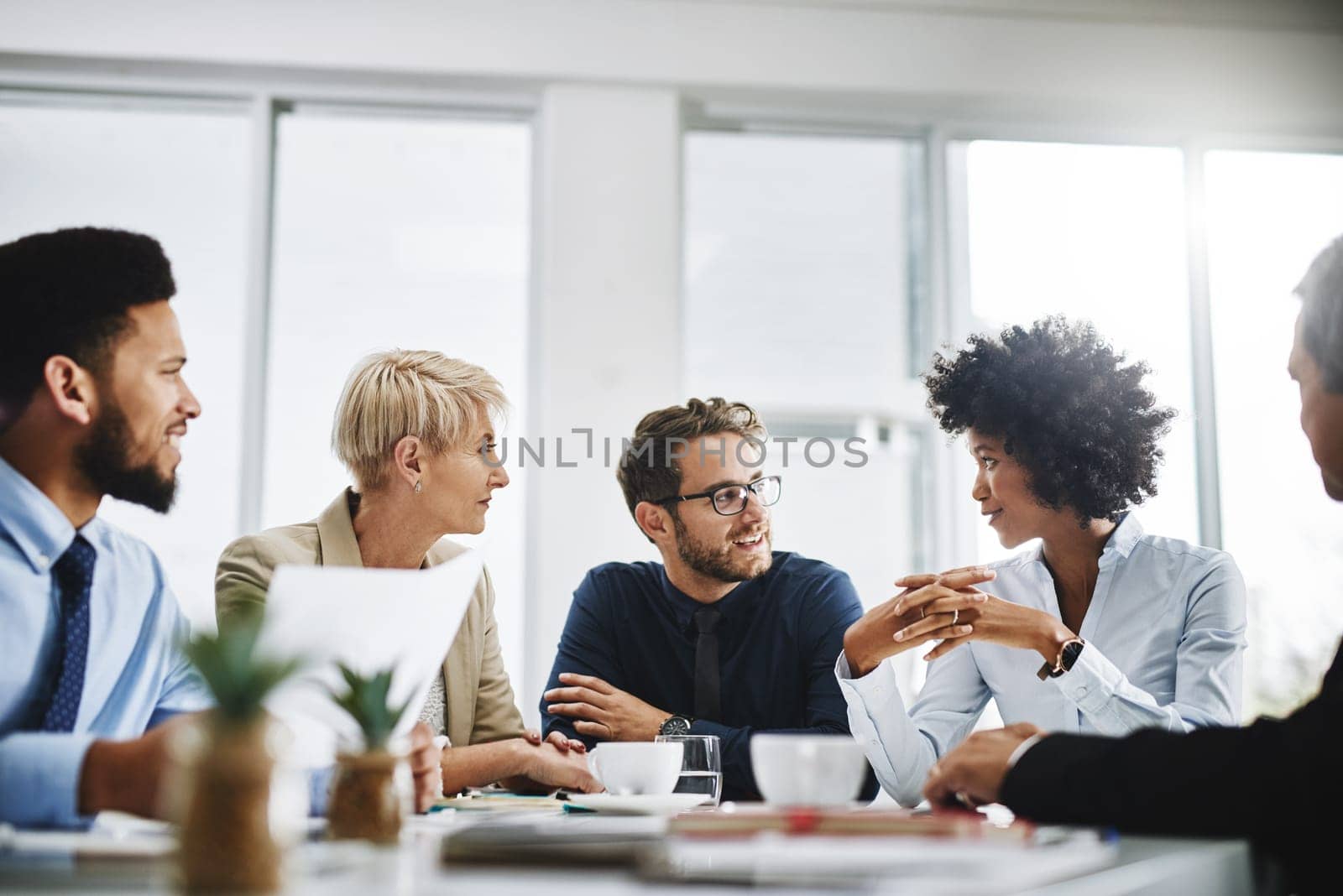 Business people, meeting and planning with company contract and deal with conversation. Staff, communication and paperwork with a businessman with diversity coworkers working on a job strategy by YuriArcurs