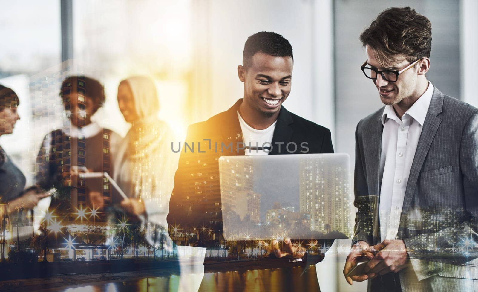 They always help each other out. a group of young cheerful businesspeople browsing on digital devices while working together in the office at work