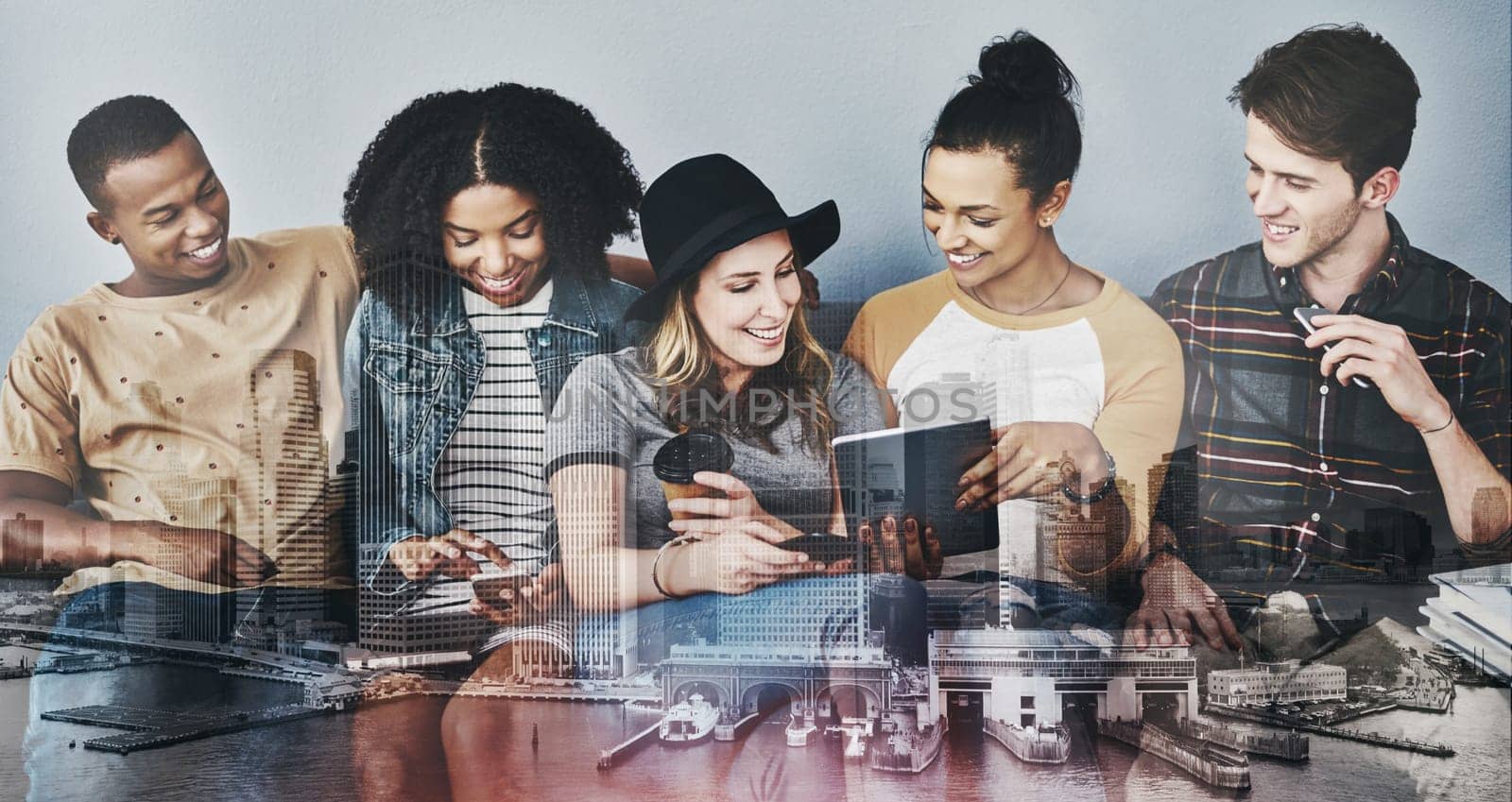 Has social media changed the meaning of social. Studio shot of young people sitting on a sofa and using wireless technology against a gray background. by YuriArcurs