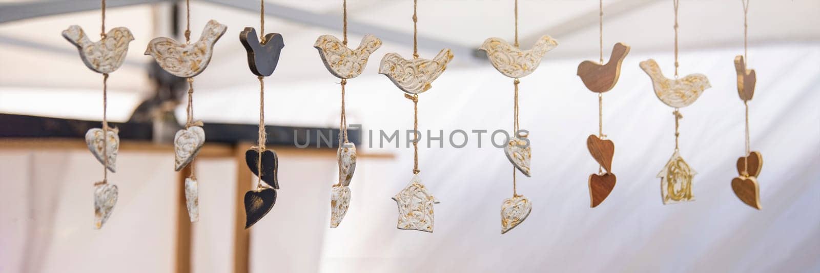 Ceramic handmade birds are attached on a rope. Designed to mount at the base of the door, make a sound when the door is opened. High quality photo