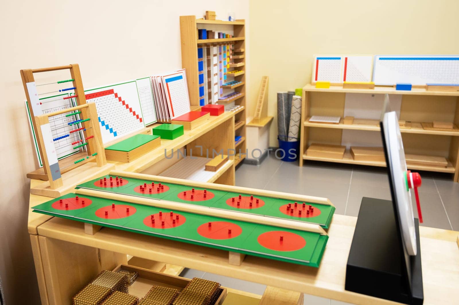 Classroom of Montessori kindergarten. The colorful Montessori material. Concept of children learning toy