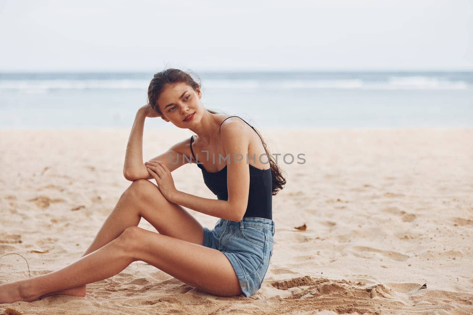 hair woman beautiful lifestyle attractive sea adult natural sand travel smile girl beach bali water carefree nature freedom vacation ocean sitting
