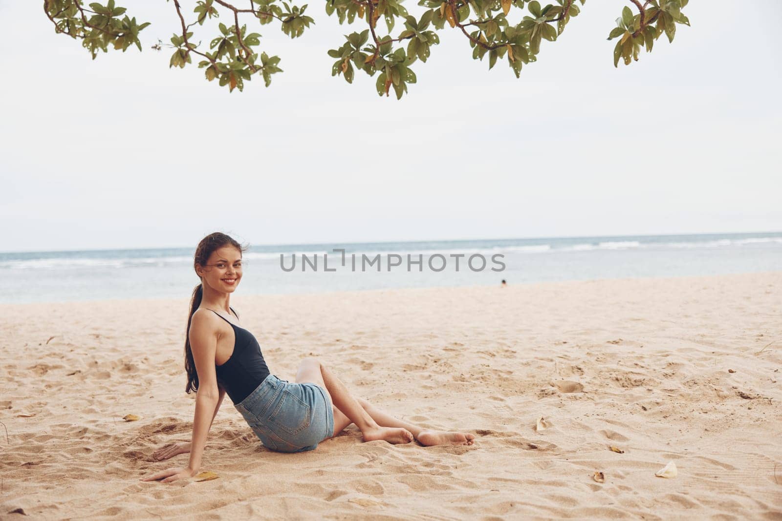 woman tan travel sea body hair sand female smile relax beach sitting young lifestyle white happy vacation long beauty freedom hair nature