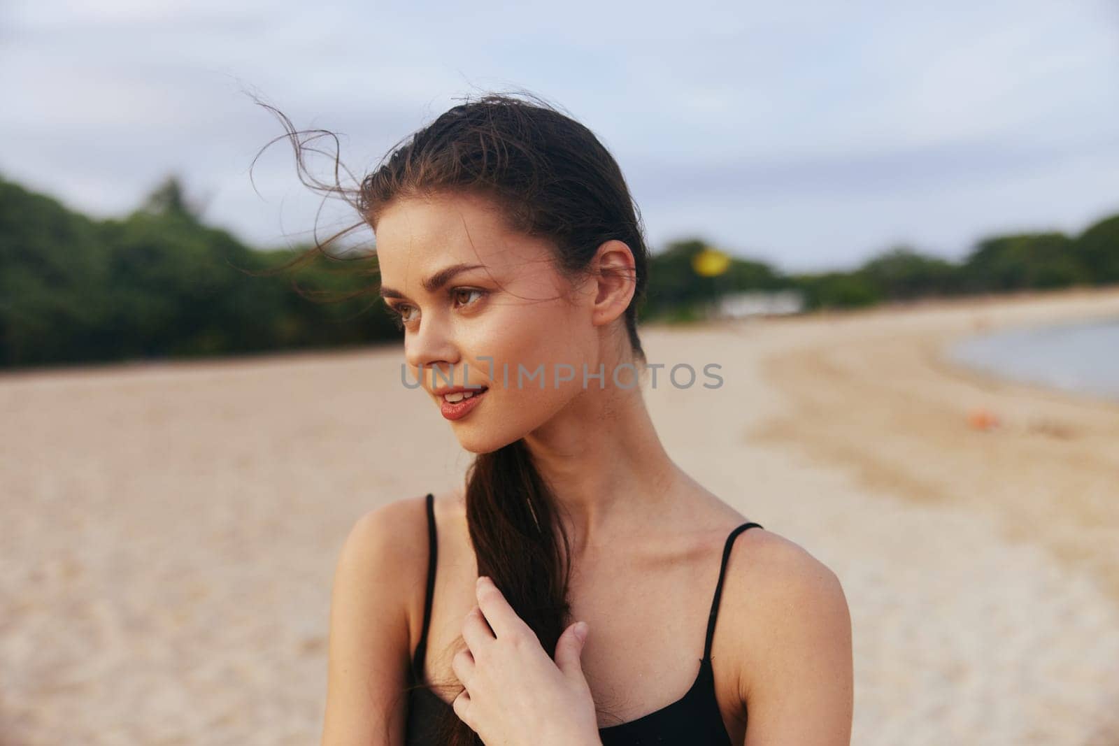 happy woman hair beach long beauty happiness walk lifestyle smile ocean female sunset sunlight sea caucasian sky vacation summer relax water sand